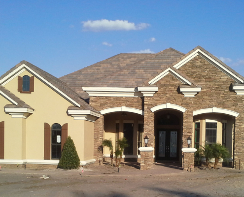 Custom home with stone veneer, stucco and foam accents - Lake Nona, Florida