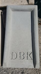 Custom precast splash block with monogrammed initials